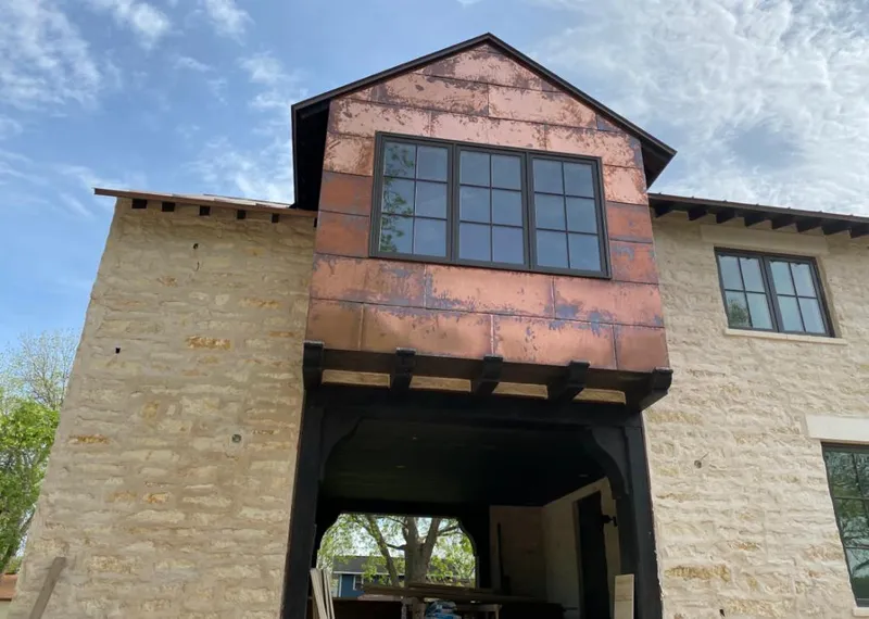 Copper metal panel facade on a stone building for Skylight Installation in Daytona Beach