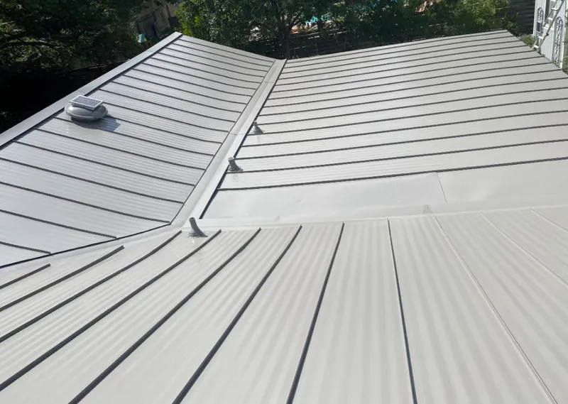 Solar attic fan installed on a metal roof for Roof Ventilation in Daytona Beach